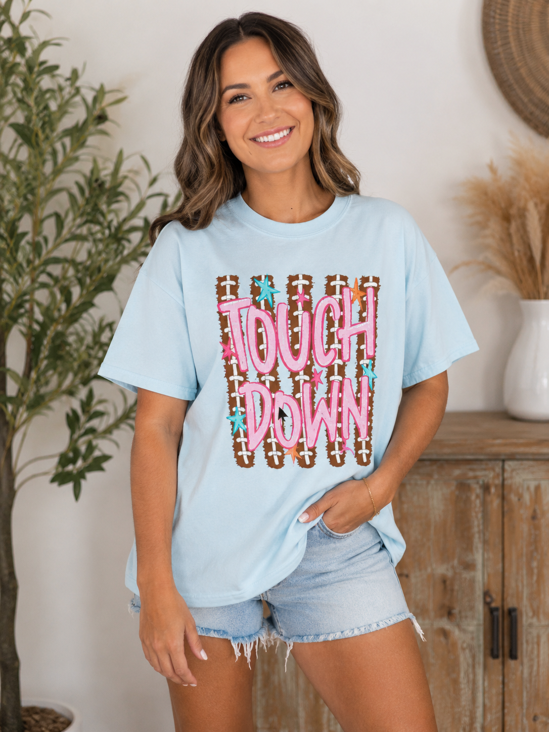 Touchdown Football Graphic T-Shirt — Retro Pink Script & Football Field Design